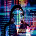code projected over woman