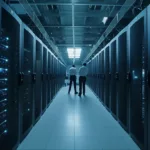a row of data servers with two men looking over them
